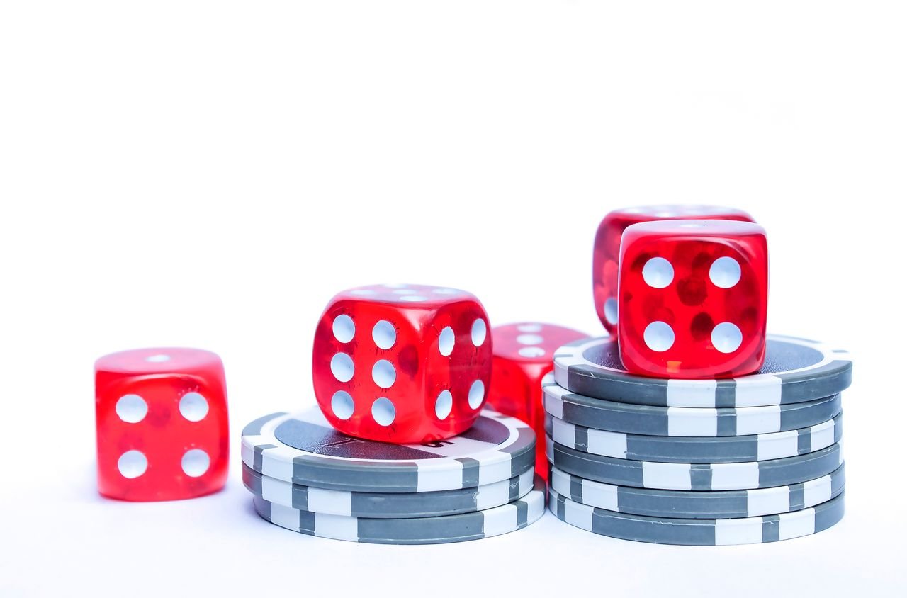 Crafting Captivating Headlines: Your awesome post title goes here Vibrant red dice stacked with poker chips, ideal for gambling themes.